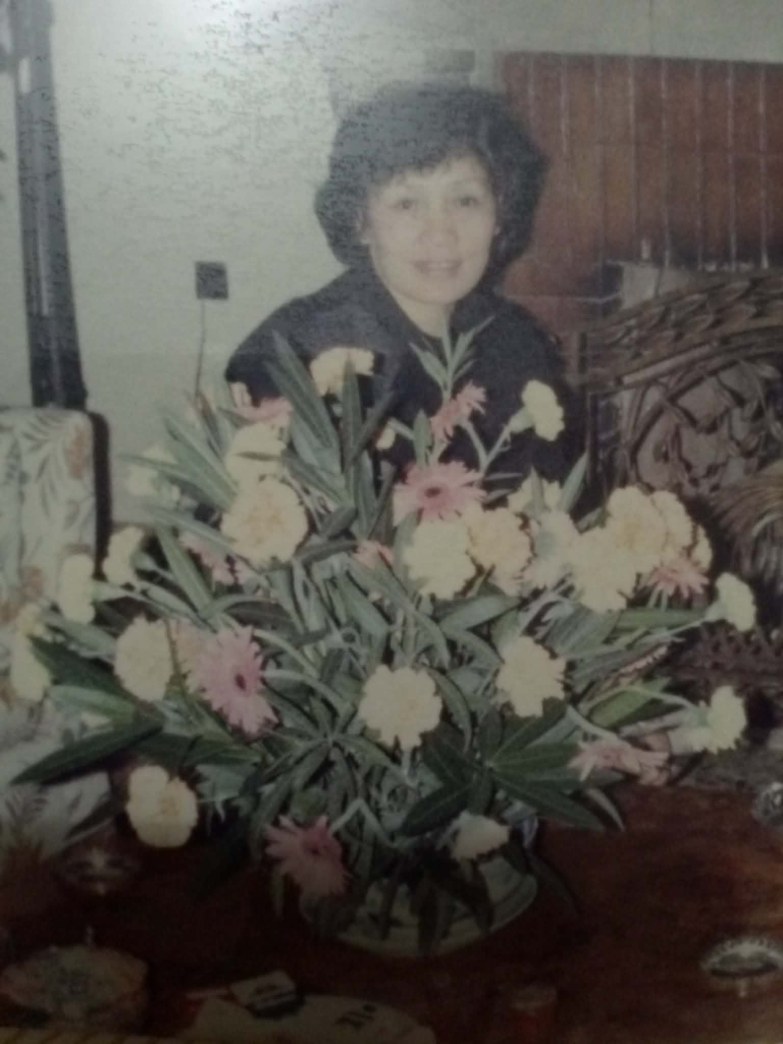 Warlita Aghbarian at home in Lebanon, surrounded by flowers